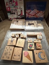 Lot of 33 rubber stamps, book and large ink pad-most are used