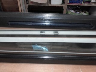 REHAU UPVC WINDOW BLACK ON WHITE OPENS FROM THE BOTTOM WITH CHROME HANDLE