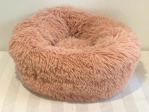 pink fluffy dog bed