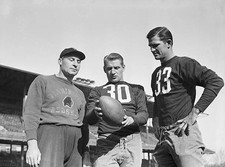 Coach Ray Flaherty of Washington Redskins is shown giving instructi- Old Photo