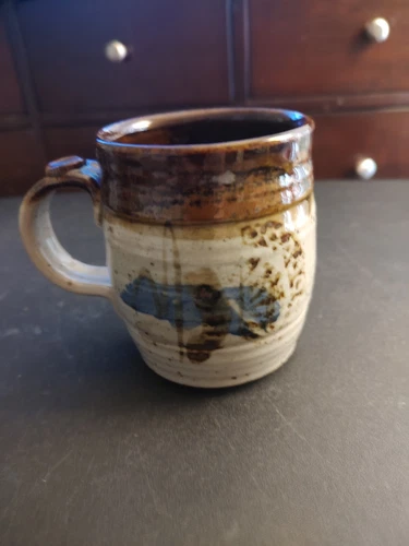 Southwestern Art Pottery Mug-signed. Colors are brown/gray & blue