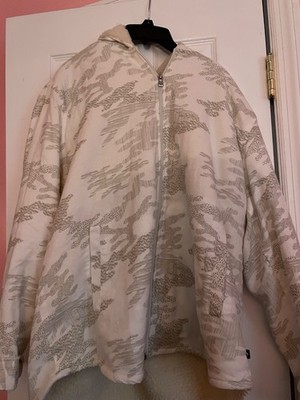 Furry, white jacket. Never worn, and it s in great condition. Very comfortable.