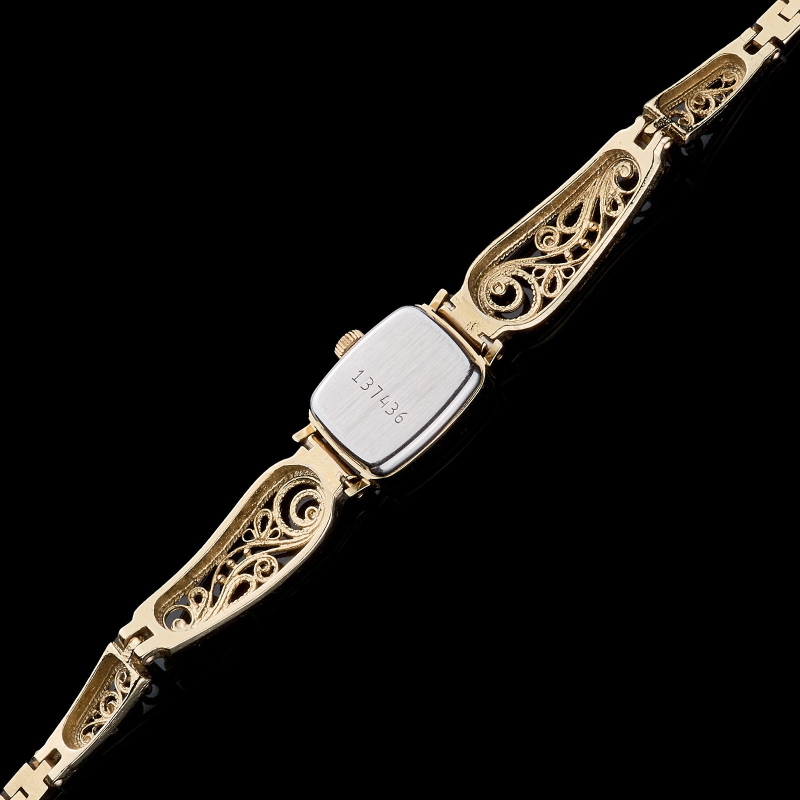 Small women's cocktail watch with gold color. Vintage women's mechanical watch.
