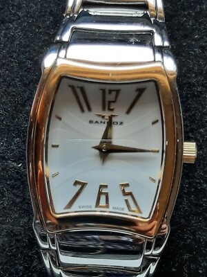 RELOJ SANDOZ ACERO CON BISEL DE ORO SOLIDO DE 18K( NO SWISS