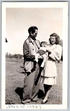 Vtg B&W Snapshot Family Portrait Parents Holding Baby Boy Outdoor June 15 1947