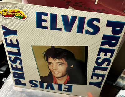Elvis Presley - '56 How A Legend Was Born LP w/ attached booklet  Near Mint