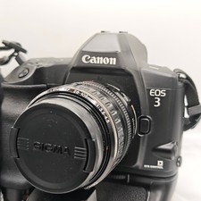 Canon EOS 3 Film Camera with Booster and 28-105 Zoom Lens. Tested and working.