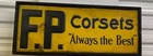 Vintage Pressed Tin Yellow/Black Corset Advert Sign w/ Wood Frame F.P. Corsets