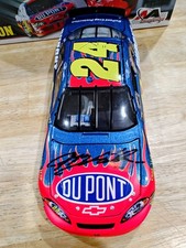 2006 Jeff Gordon Autographed 24 DuPont 75TH WIN 1/24. JG Hologram And COA.