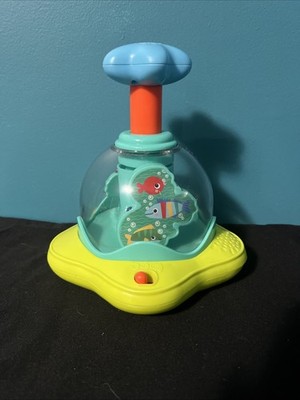 Bright Starts Press & Glow Spinner Cause and Effect Musical Baby Toy, Age 6 Mths