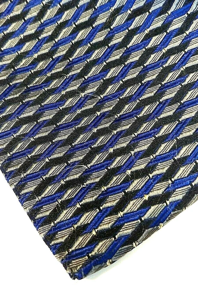Corbata de seda italiana para hombre TOM JAMES, INOCENTI tejida geométrica negra azul, dorada Foto 2 de 4