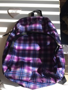 purple and black backpack