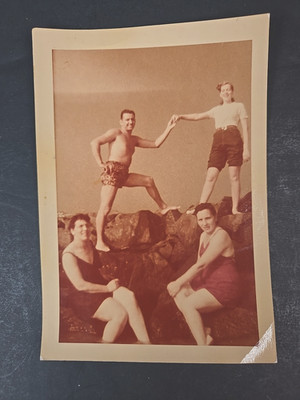 1948 real photo 3 women 1 man posing on rocks swim suits sepia Kodacolor