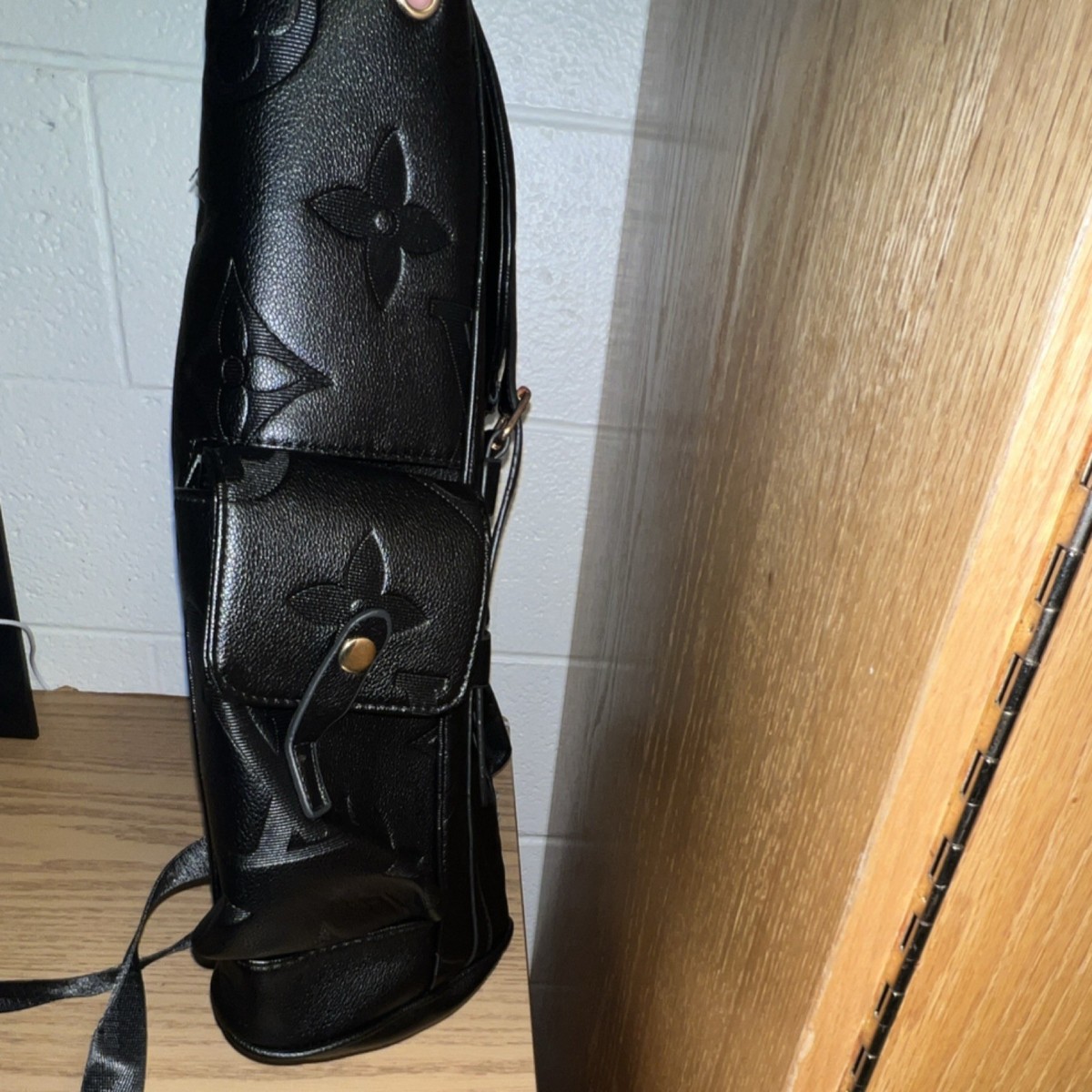 Louis Vuitton Black Monogram Embossed Logo Backpack Gold  display picture 3