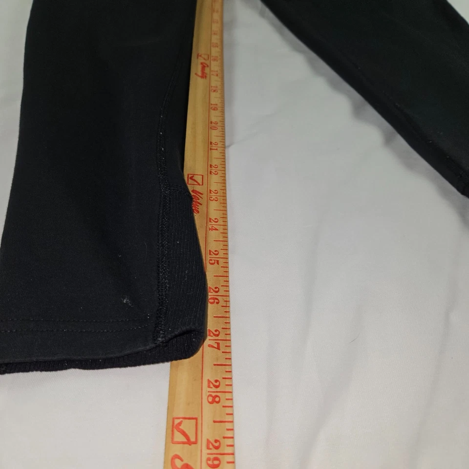 Pantalones deportivos Nike Tech polar para hombre medianos negros Swoosh pierna cónica Foto 2 de 4