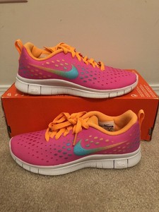 orange nike shoes youth