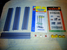 Mixed Lot of HO  Model Train Items - Track, Livestock, Highway Lights, Gas Pumps