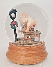 Santa in Workshop Musical Snow Globe Plays Santa Claus Is Coming to Town