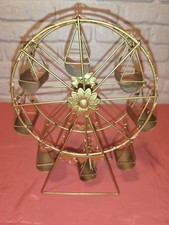 Soporte giratorio para cupcakes rueda de la fortuna de metal dorado o candelabro decorativo.