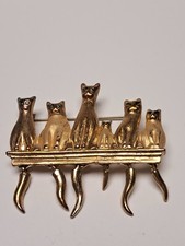 CAT PIN GOLD TONE WITH MOVING TAILS AND GREEN EYES