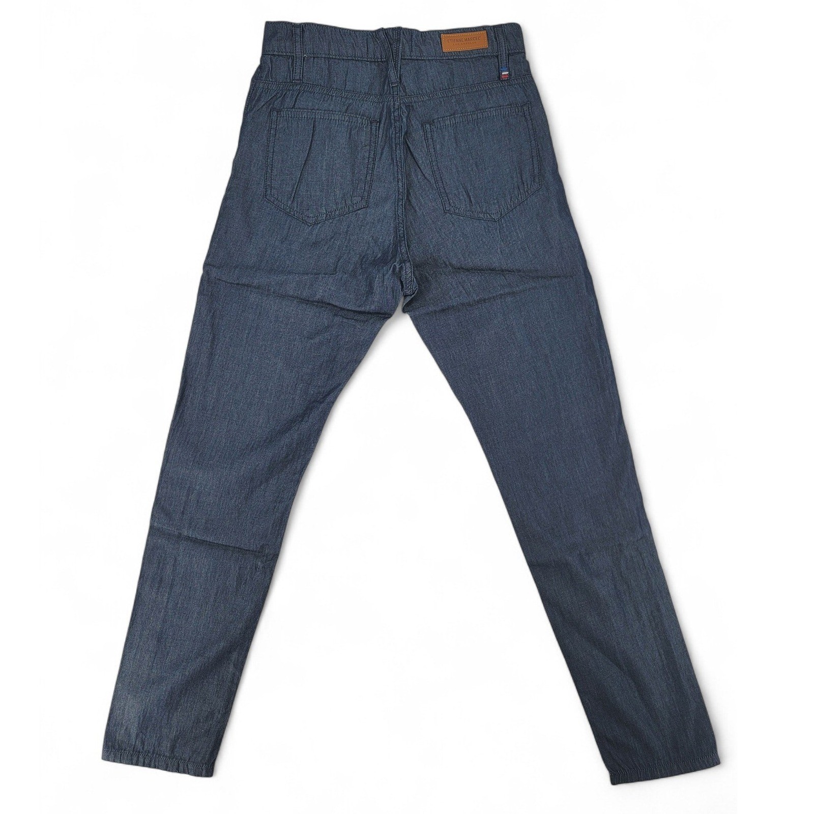 Etienne Marcel skinny crop jeans, blue denim, back view with tan leather patch, brown stitching, and two rear pockets.
