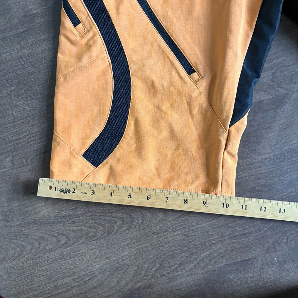 Pantalones cortos de ciclismo Race Face Ambush naranja talla grande para hombre Foto 4 de 4