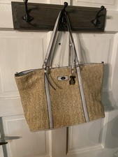 TOUS woven straw tote bag featuring the brand...