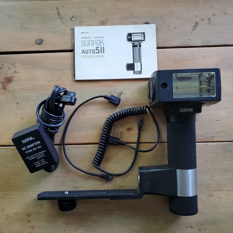 Camera Flash with Bracket and Cords. Works great!