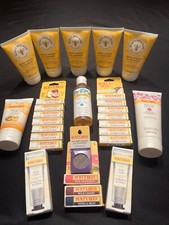 multiple Burt's Bees products: lip balm, cleansers, diaper cream