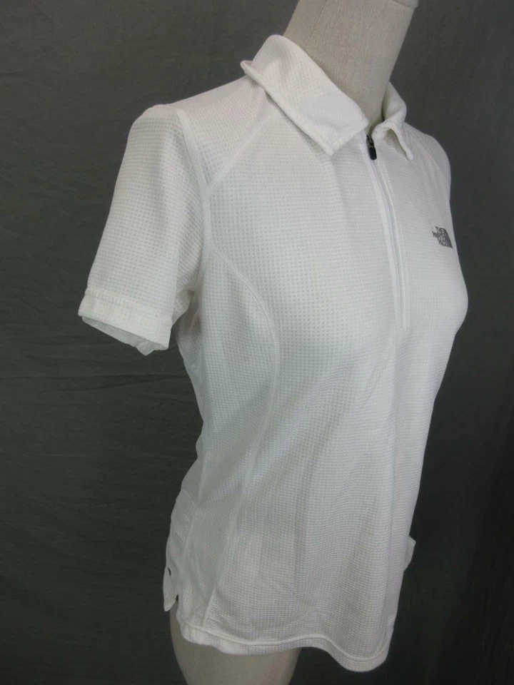 CAMISA POLO ATLÉTICA MUJER THE NORTH FACE BLANCA MANGA CORTA 1/2 CREMALLERA T584 Foto 3 de 4