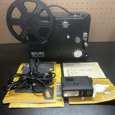 Bolex 18-3 TC Projector with Carrying Case, Instruction Book, And Other Material