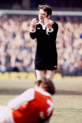 Referee Pat Partridge encourages Arsenal Bob McNab to get up 1978 Old Photo