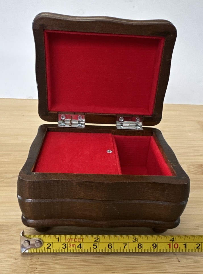 A Schmid Bros Japan-made wooden jewelry music box playing 'Little Green Apples' is a beautifully crafted mid-century piece with serious nostalgic charm.