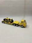 Vintage Tonka low bed truck bulldozer.