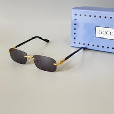 Gucci GG1221S 001 Black Gold Rimless Sunglasses Gray Lens 56mm