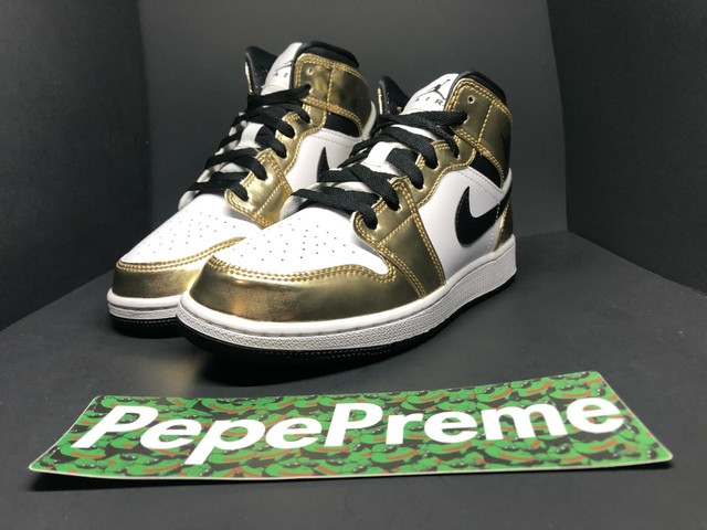 gold and black nike jordans