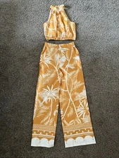 Two piece outfit with halter top and flare pants