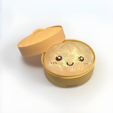 Glitter-filled stress relief dumpling squishy in box