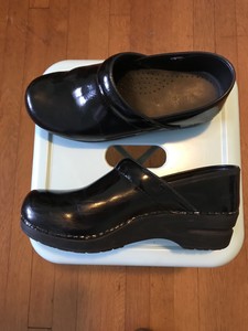 sanita black patent clogs