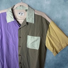 Vintage Silk Circa 1969 short-sleeve button-up shirt made from 100% silk.