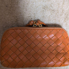 Pochette cosmetica Bottega Veneta in pelle intrecciata arancione usata