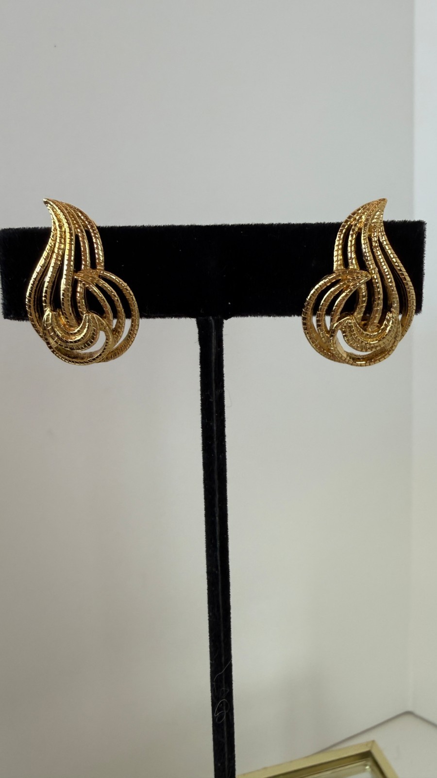Vintage Monet Gold Tone Swirl Clip On Earrings | Signed Textured Openwork