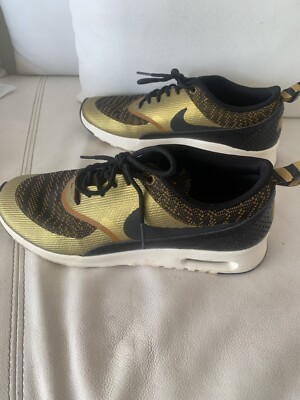 black and gold nike air max thea