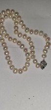 Akoya pearl necklace with a decorative Sterling Silver clasp.