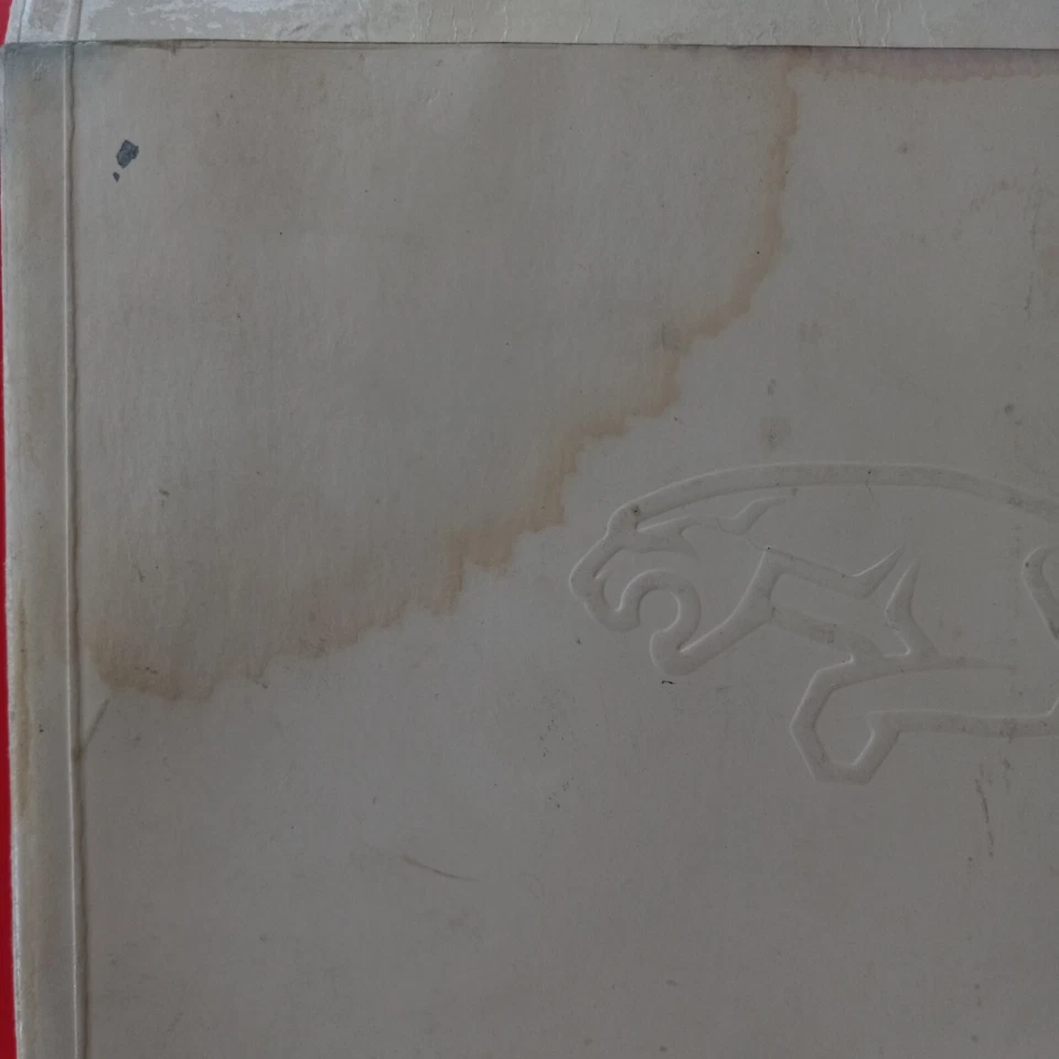 Juego manual del propietario Jaguar XJ6 1990 vintage con carpeta de cubierta. Algunos daños por agua Foto 3 de 4