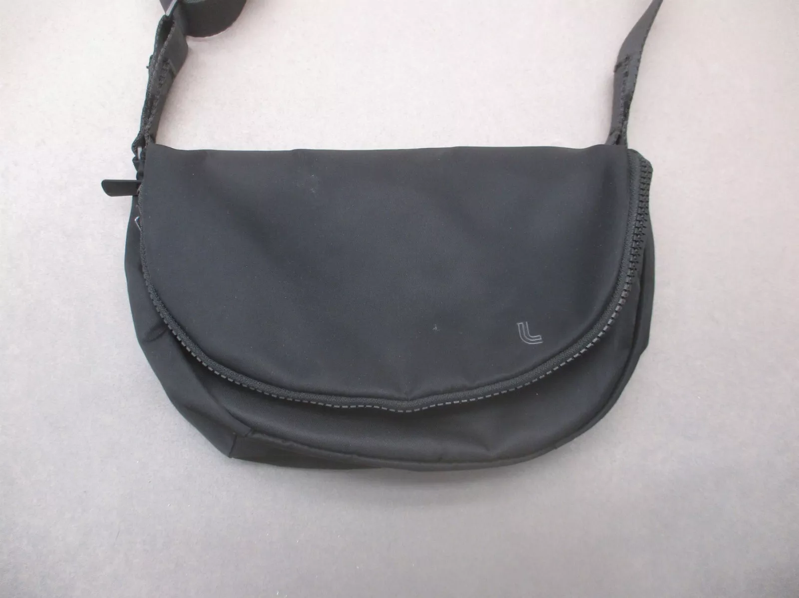 lole back zip pocket snap crossbody 