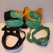  2 ea. kid safety harness. Green dinosaur characters, 1 black and one yellow.