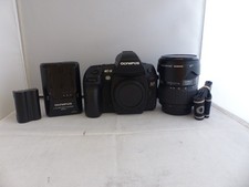 Olympus E-5 12.3MP with Olympus 14-54mm zoom lens. Looks and works great.