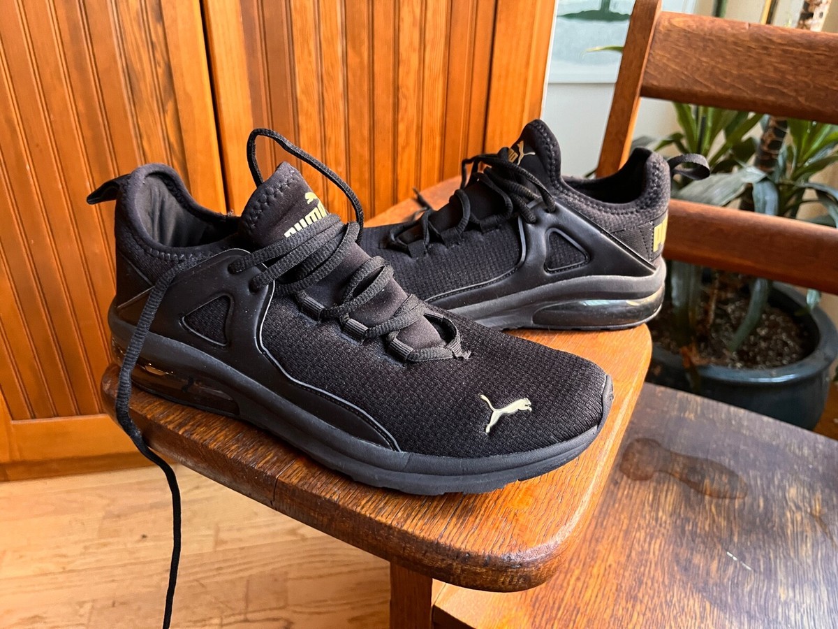 Puma Electron black slip on sneakers w/ gold accent womens