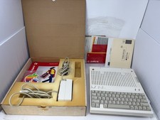 Apple IIC A2S4000 vintage con alimentatore e documenti ~ si accende ~ per ricambi/riparazione